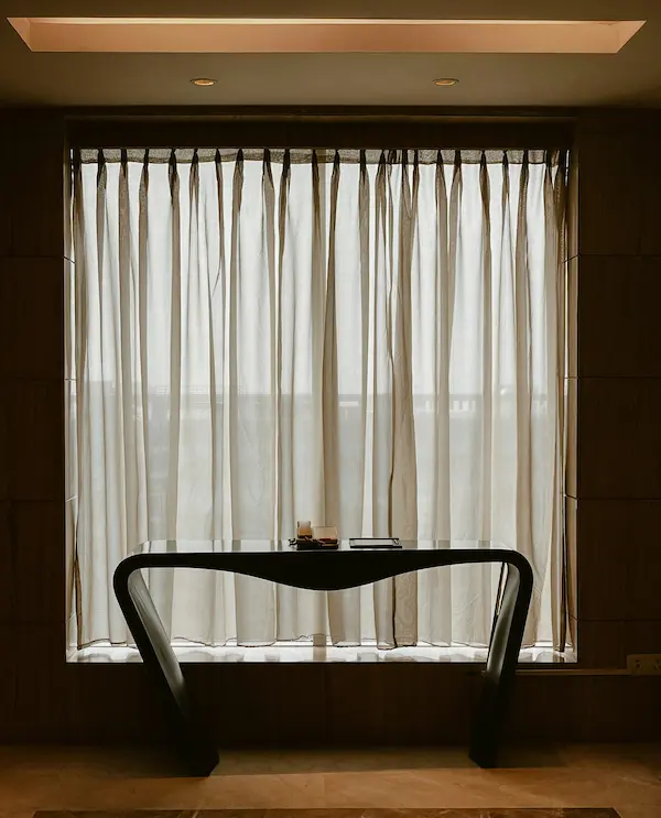 Sheer curtains in a quiet luxury room